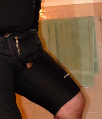 Penis/Buttplugged Inline Skating in Full Steel Chastity belt under Speedos. Steel Tube housed in waist bag discreetly produding